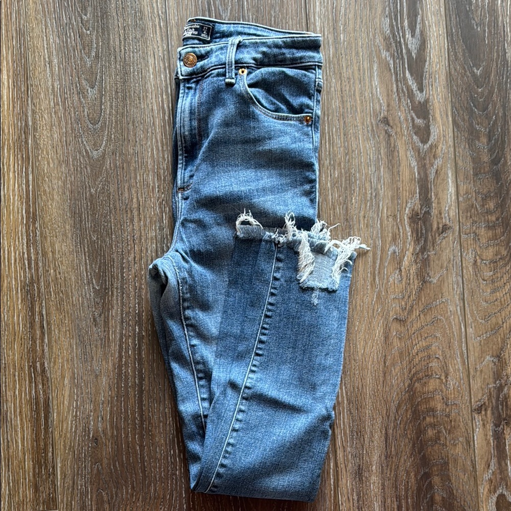 Distressed Blue Denim Jeans
